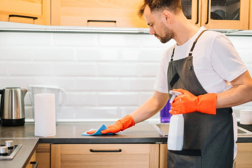 Kitchen cleaning expert of sunshine cleaning countertop of a home in Riyadh